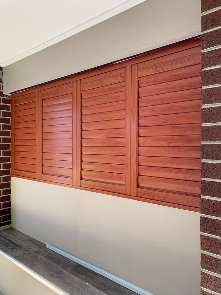 White plantation shutters fitted to bay windows